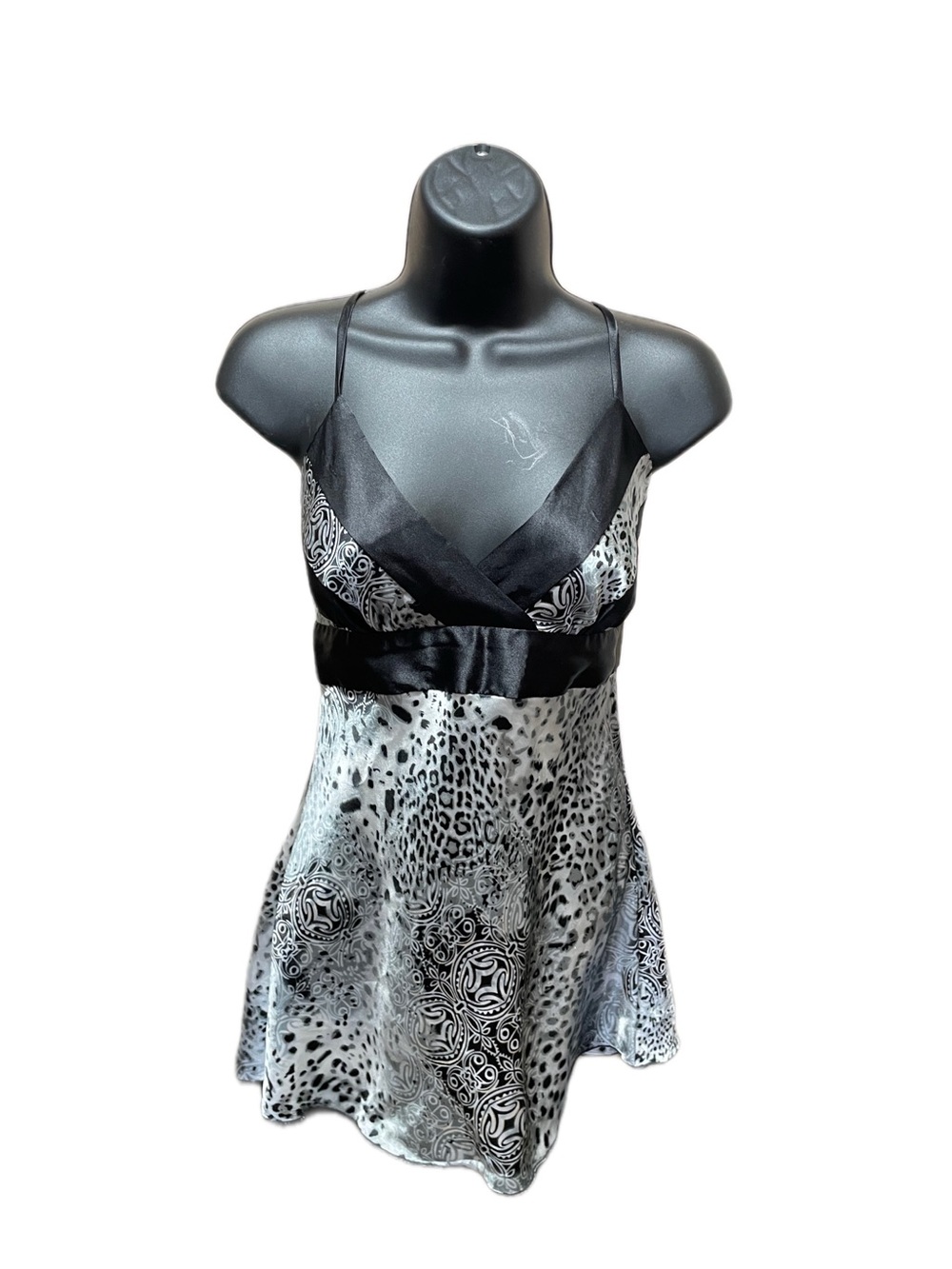 A. Byer black and white leopard print satin blouse with bow detail, size M